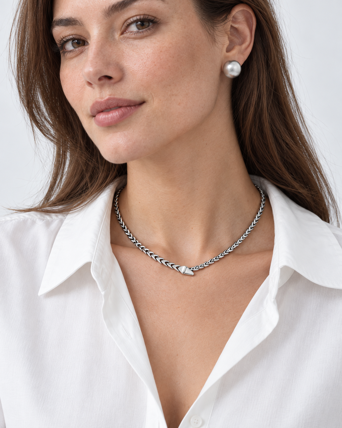 Silver necklace worn by the model